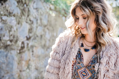 Preview: Woman enjoying a sunny day outdoors