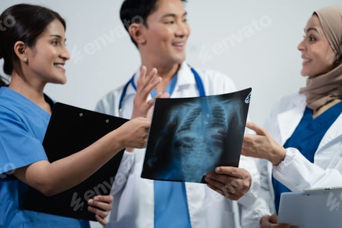 Preview: Medical Professionals Reviewing X-ray in Hospital Setting