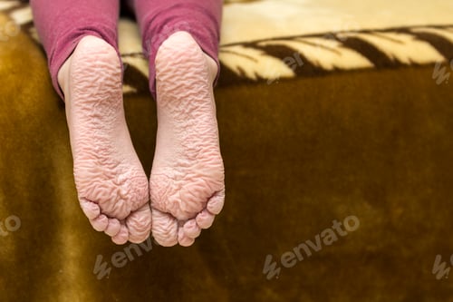 Preview: Close-up of children wrinkled feet after long bath