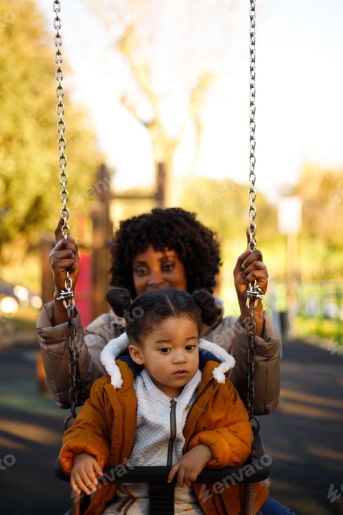 Preview: Black mom swinging daughter