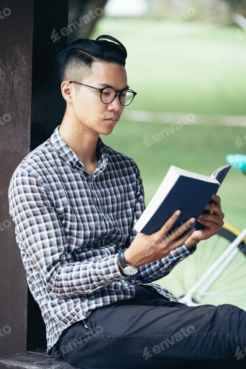 Preview: Man Reading Captivating Book