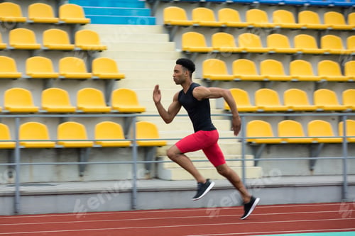 Preview: African athlete man run on running track outdoors