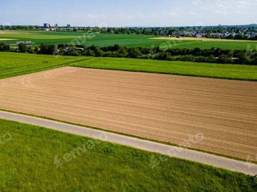 Preview: Farmland from above. Aerial view over green fields