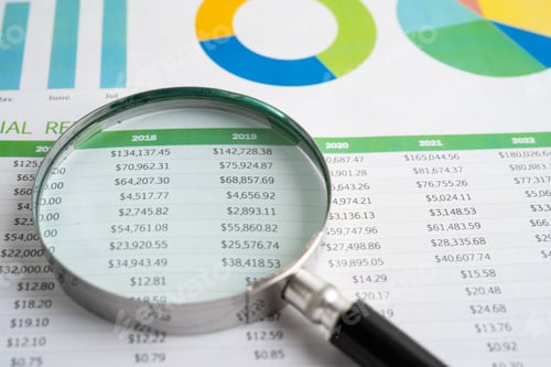 Preview: Magnifying glass on spreadsheet and graph paper. Financial development, Banking Account, Statistic,