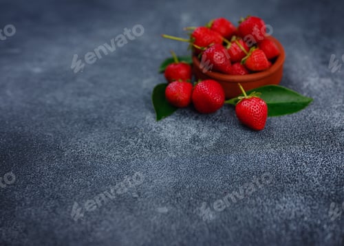 Preview: Fresh organic strawberries , over dark background
