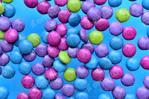 Preview: Colorful candy on the blue background