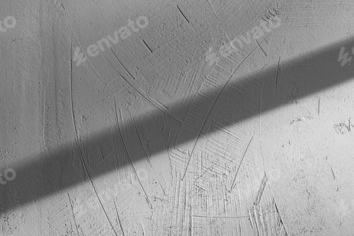 Preview: close-up view of light and shadow on gray concrete wall textured background