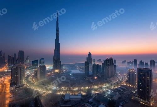 Preview: Cityscape of Dubai, United Arab Emirates at dusk, with the Burj Khalifa skyscraper and illuminated