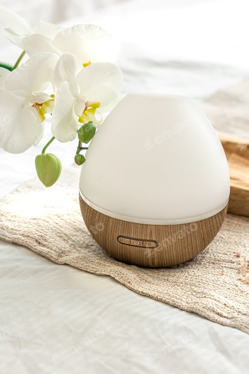 Preview: Modern oil aroma diffuser close up on a blurred background.