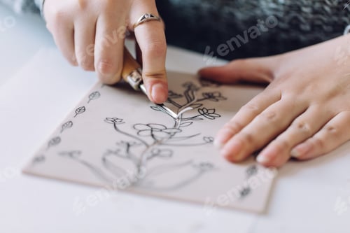 Preview: Concentrated crop woman doing linearity and first sketches in office