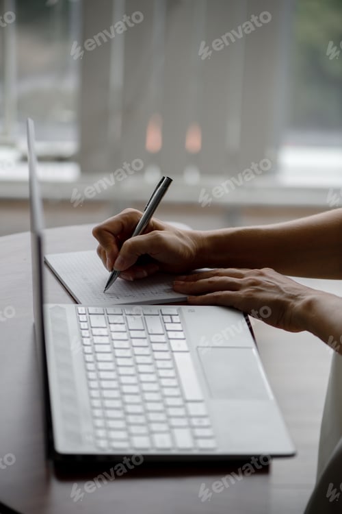 Preview: Business woman. A girl with a diary and a laptop. Girl's hands