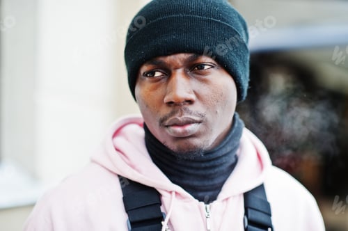 Preview: Stylish urban style african american man in pink hoodie