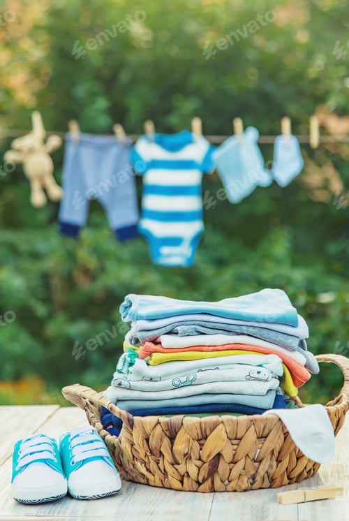 Preview: washing baby clothes. Linen dries in the fresh air. Selective focus.