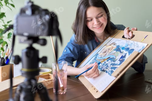 Preview: Artist, teenage girl, draws and records on video camera for his blog