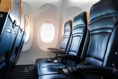 Preview: Plane interior - cabin with modern leather chair for passenger of airplane.
