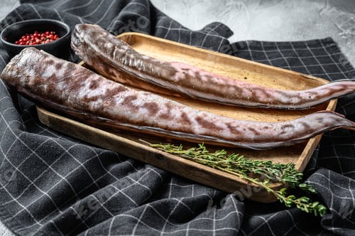 Preview: Raw sea eel fish with cooking ingredients. gray background. Top view