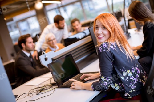 Preview: business people with young adults and senior woman colleague