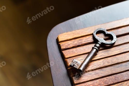 Preview: the old key lies on an old wooden table, natural textures, the concept of discoveries, secrets
