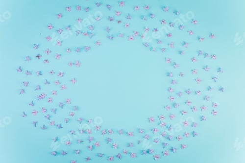 Preview: Petals of violet lilac on a blue background.