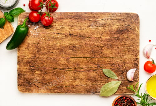 Preview: Wooden Cutting Board Surrounded by Fresh Ingredients