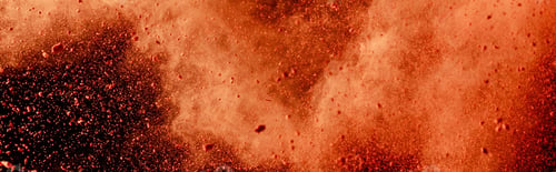 Preview: orange colorful holi paint explosion on black background, panoramic shot