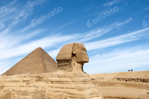 Preview: Ancient Egyptian pyramids and the Great Sphinx of Giza against a blue cloudy sky on a sunny day