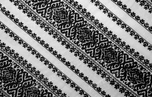 Preview: Embroidery (stitching) on a white cloth with traditional motifs