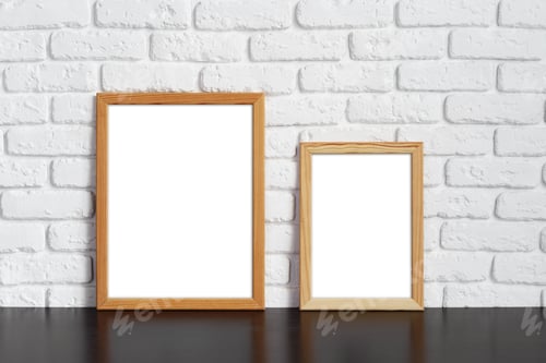 Preview: Blank picture frame against brick wall with copy space