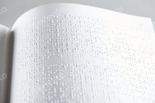 Preview: close up view of book with braille text isolated on grey