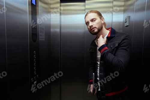 Preview: Guy with the laptop is in the passenger elevator