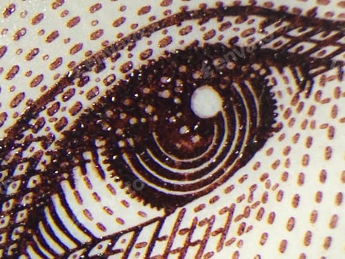Preview: close up of a drawing of an eye on a money bank note