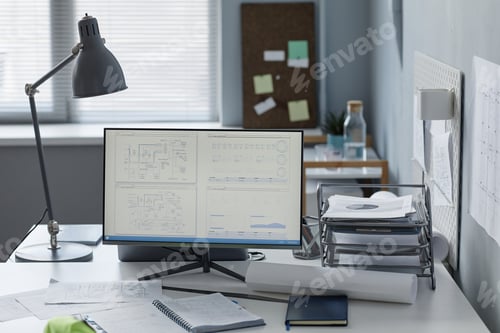Preview: Engineers workplace in office with plans on computer screen