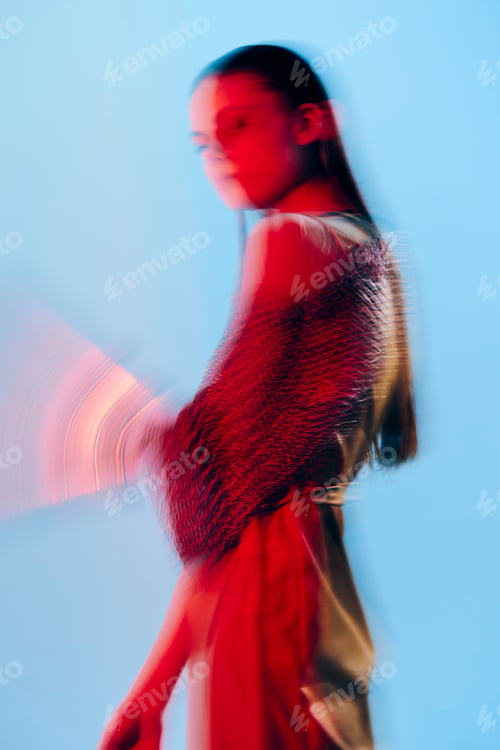 Preview: photo pretty woman Glamor posing red light metal armor on hand isolated background