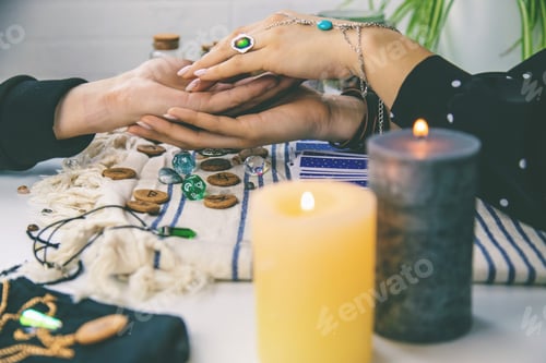 Preview: A fortune teller reads with tarot cards. Selective focus.