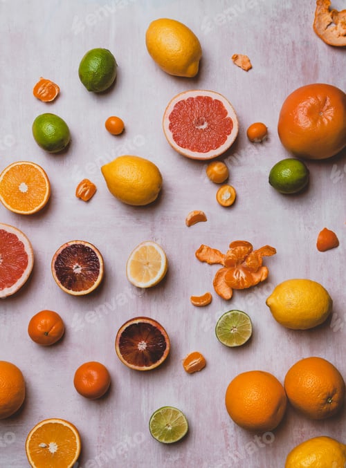 Preview: elevated view of limes, grapefruit, lemons, oranges, blood oranges, tangerines and kumquats on table