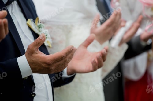 Preview: Selective focus shot of people applauding during a wedding ceremony
