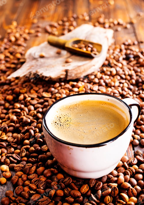 Preview: Coffee in cup on wooden table in cafe