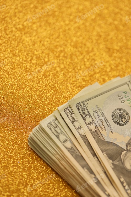 Preview: Big amount of old twenty dollar bills on golden background