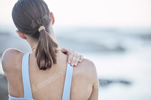 Preview: Back pain, stretching and woman at beach for fitness, body training and muscle accident during exer