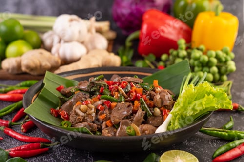 Preview: Stir-fried chicken liver basil on banana leaves in a black dish