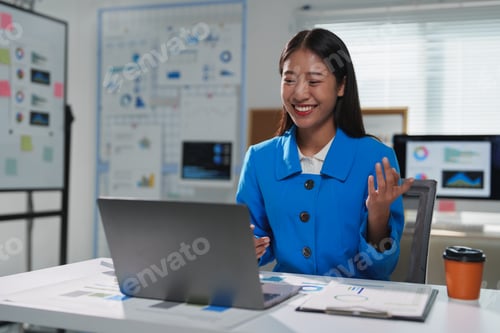 Preview: Young manager attending a web conference and discussing strategy with colleagues