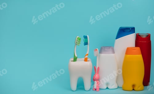 Preview: Shower accessories on a colored background. bathroom setting on blue background.