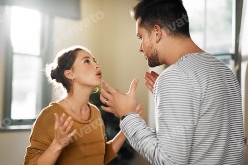 Preview: You never listen. Cropped shot of a young couple having an argument at home.