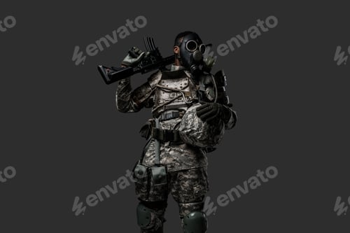 Preview: Armed soldier of african descent with gas mask and rifle
