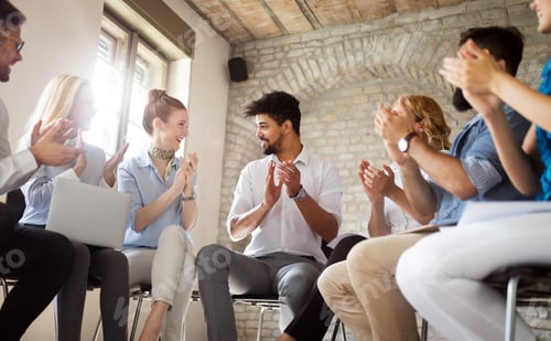 Preview: Business team celebrating a good job in the office