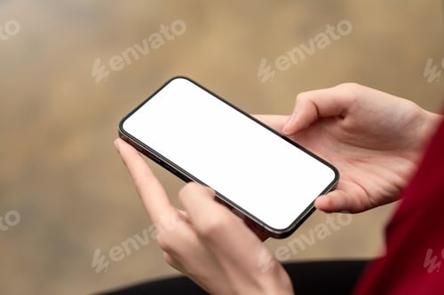 Preview: Image of a businesswoman working with a smartphone blank white screen at the office. Mock up.