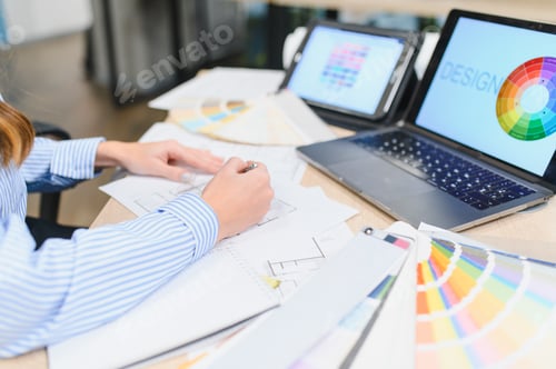 Preview: Designer collaborating on creative project with technology and color palette