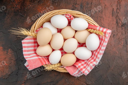 Preview: top view white chicken eggs inside basket with towel on dark background raw farm photo animal meal