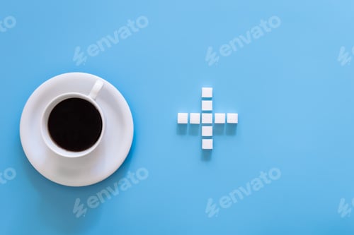Preview: A cup of coffee and a plus sign made of sugar, flat lay.