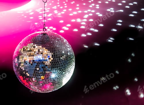 Preview: Mirrored Disco Ball Reflecting Light in a Dark Room